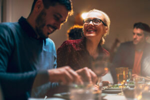 Group Of Friends Having Fun During A Dinner Celebration