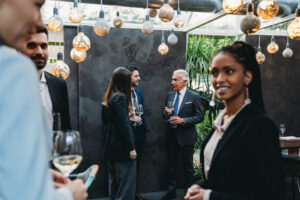 Elegant people are talking together in an high-end restaurant during the aperitif